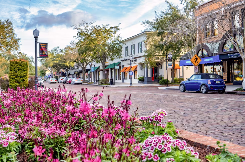 Park Avenue in Winter Park, Florida — a brick-paved Main Street lined with local shops and storefronts